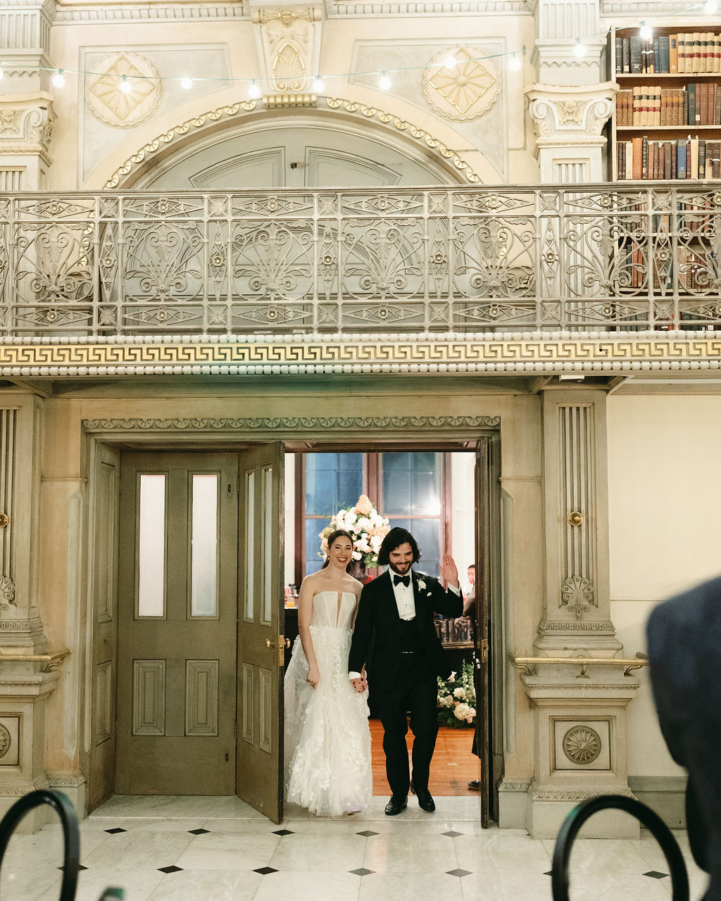 Madeline-Serio-Photography_Mollie-Sam_10-26-24 (1) The couple entering the library.