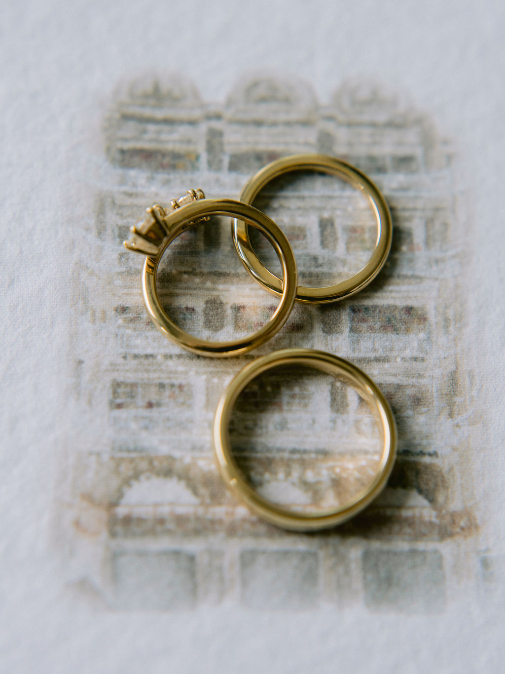 NikkiSanterre Photography_Emily&Daniel_9-1-24 (13) The couple's rings on a invitation.