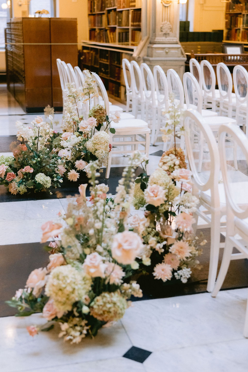 NikkiSanterre Photography_Emily&Daniel_9-1-24 (21) Flower arrangement in the aisle.